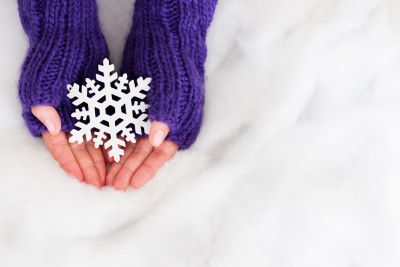 Hands holding snowflake